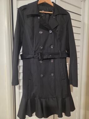 New york and company Xlarge belted trench coat with ruffled hem.
